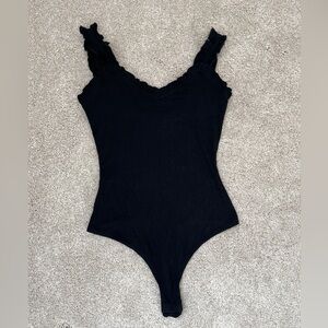 Pink Lily Black Ruffled Bodysuit